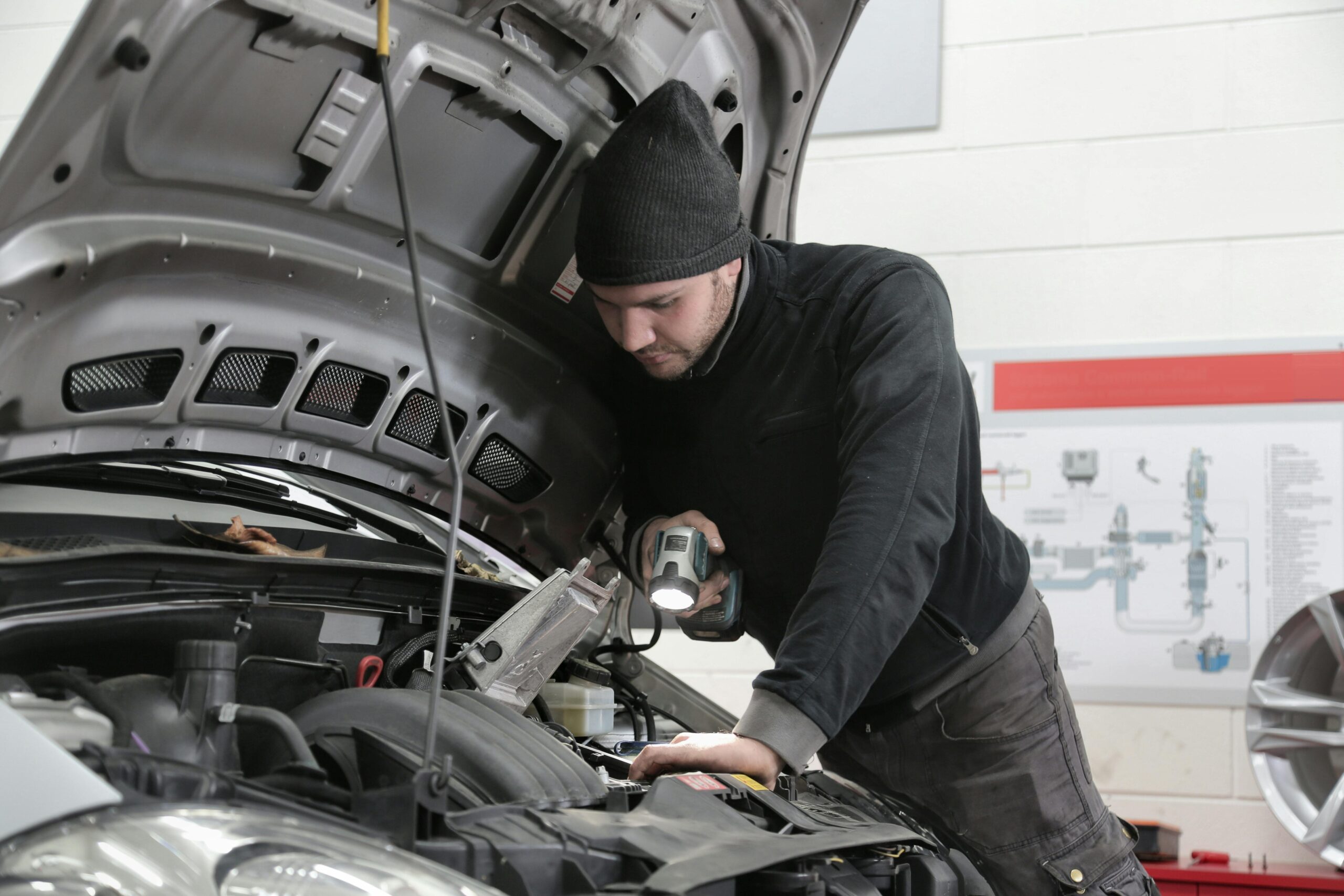 Man doing Car maintenance and giving car tips